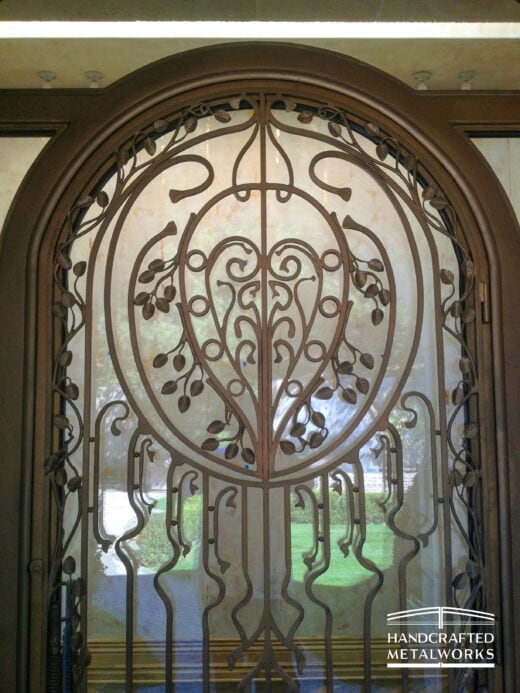 Ornate double arched front custom doors