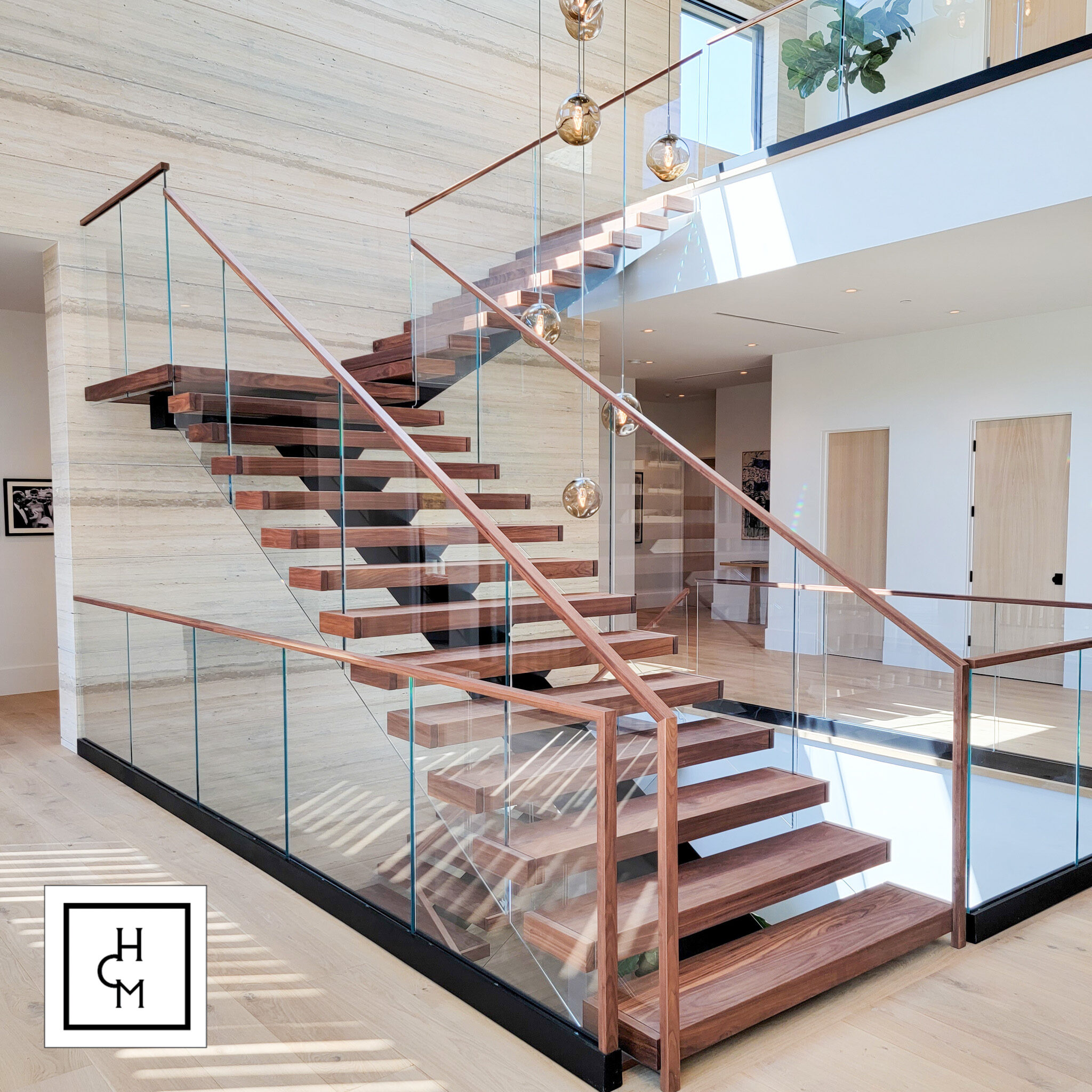 Modern glass stair railing with wood steps